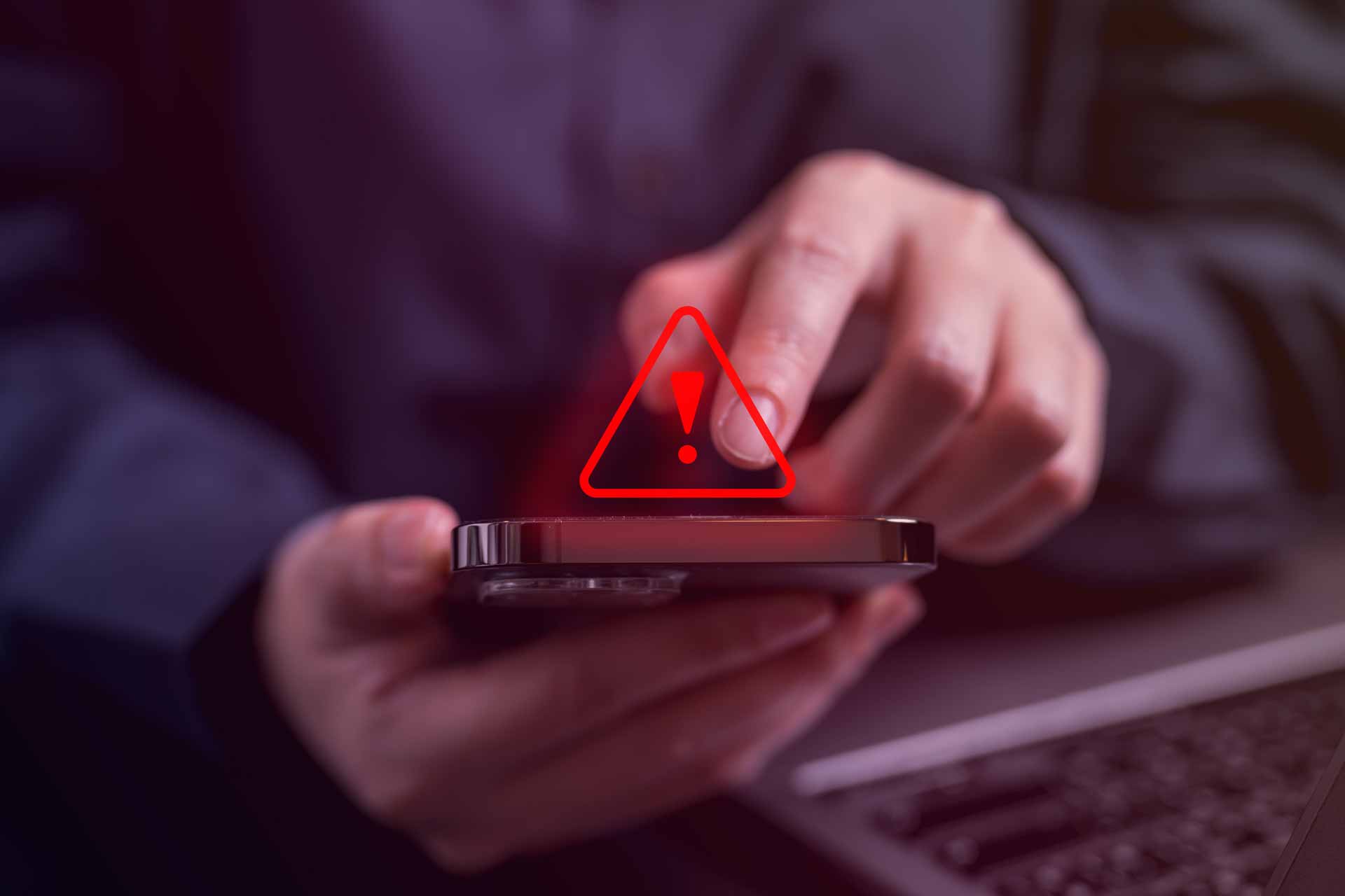 A hand hovers over a smartphone, about to accept a call. A red "alert" icon is superimposed over the photo.